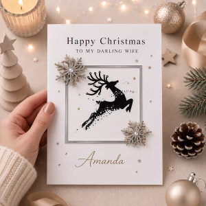 Personalised luxury reindeer Christmas card with elegant silver and gold snowflakes, festive reindeer design and custom name or recipient wording.