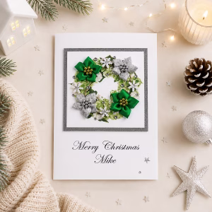 Personalised luxury Christmas card for wife with elegant green and silver festive wreath, personalised with her name.