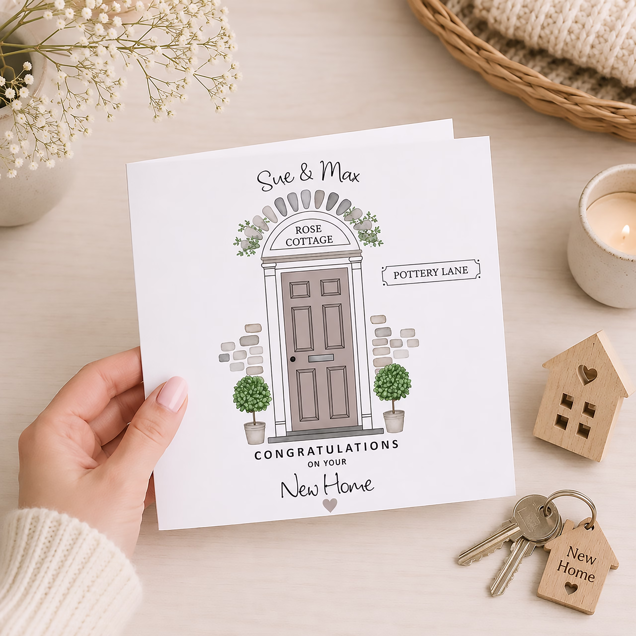 New home congratulations card with a personalised house number, street name and illustrated front door.