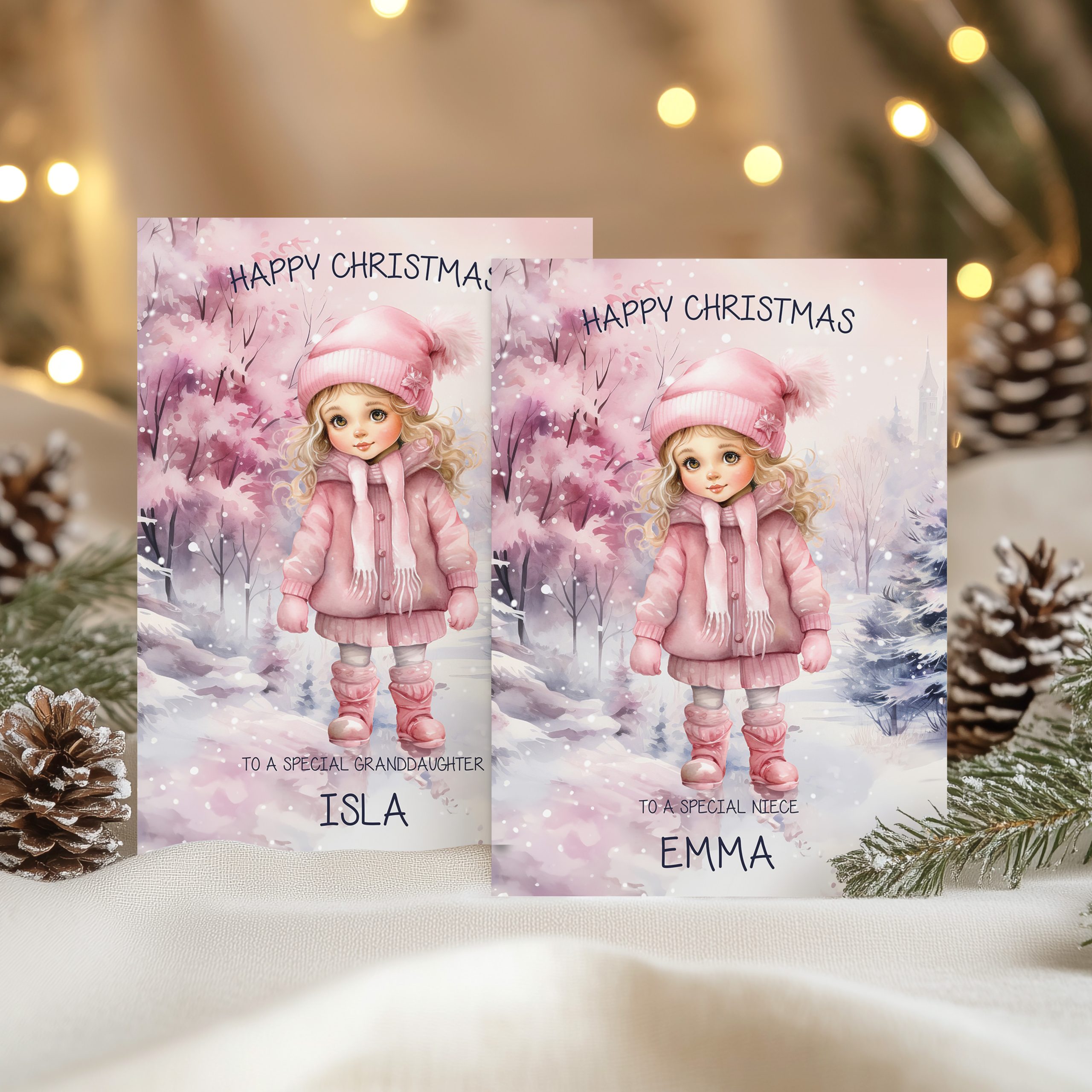Personalised girls Christmas Card, with a young girl in a snow scene wearing a pink bobble hat and coat.