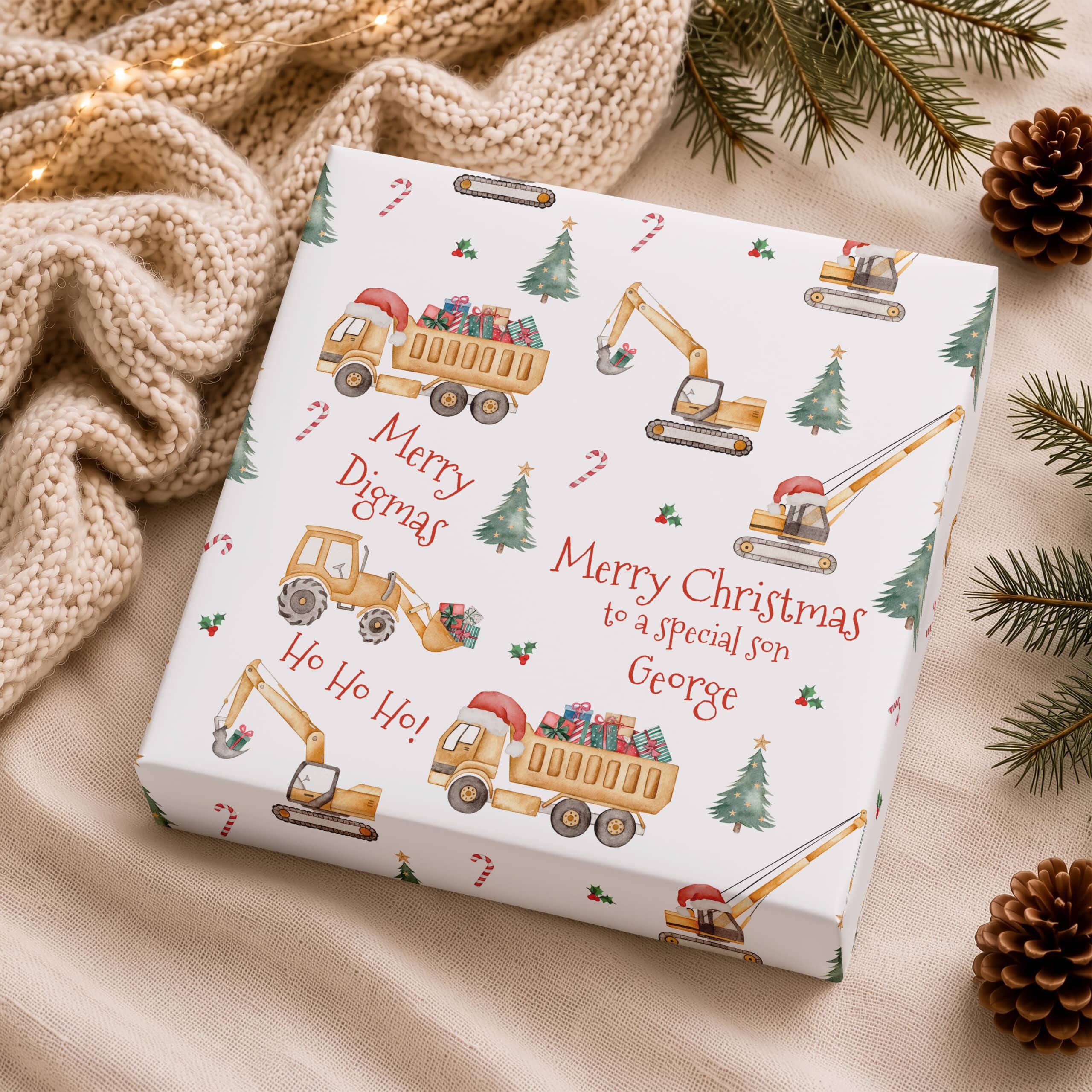 Personalised construction Christmas gift wrap with wrapped present and festive digger design