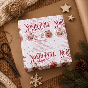 Christmas presents wrapped in personalised Santa wrapping paper with child’s name
