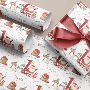 Personalised Baby's 1st Christmas Wrapping Paper, with santa and a snow man in front of a large red number one.