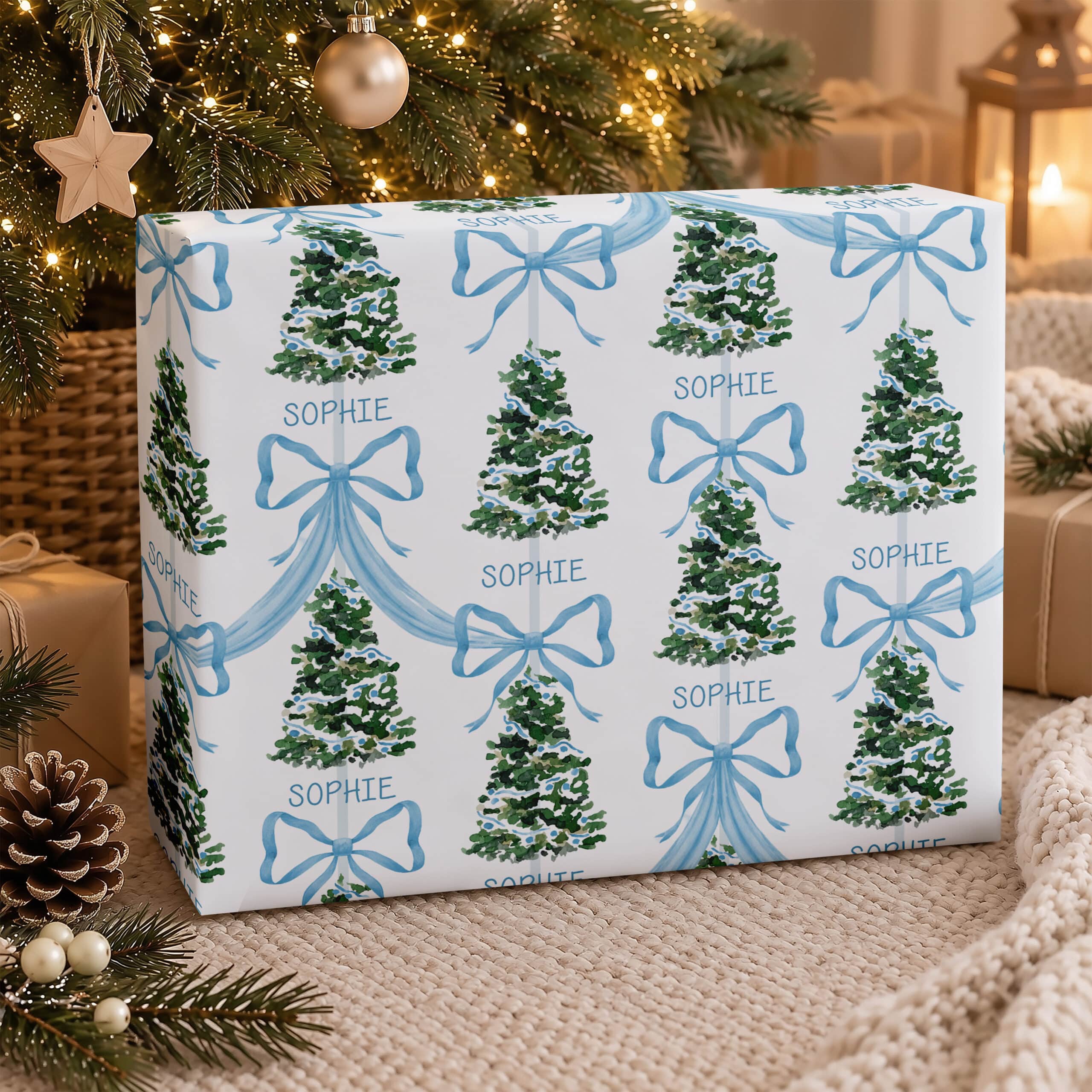 Personalised Christmas wrapping paper with child’s name, blue bows and green trees