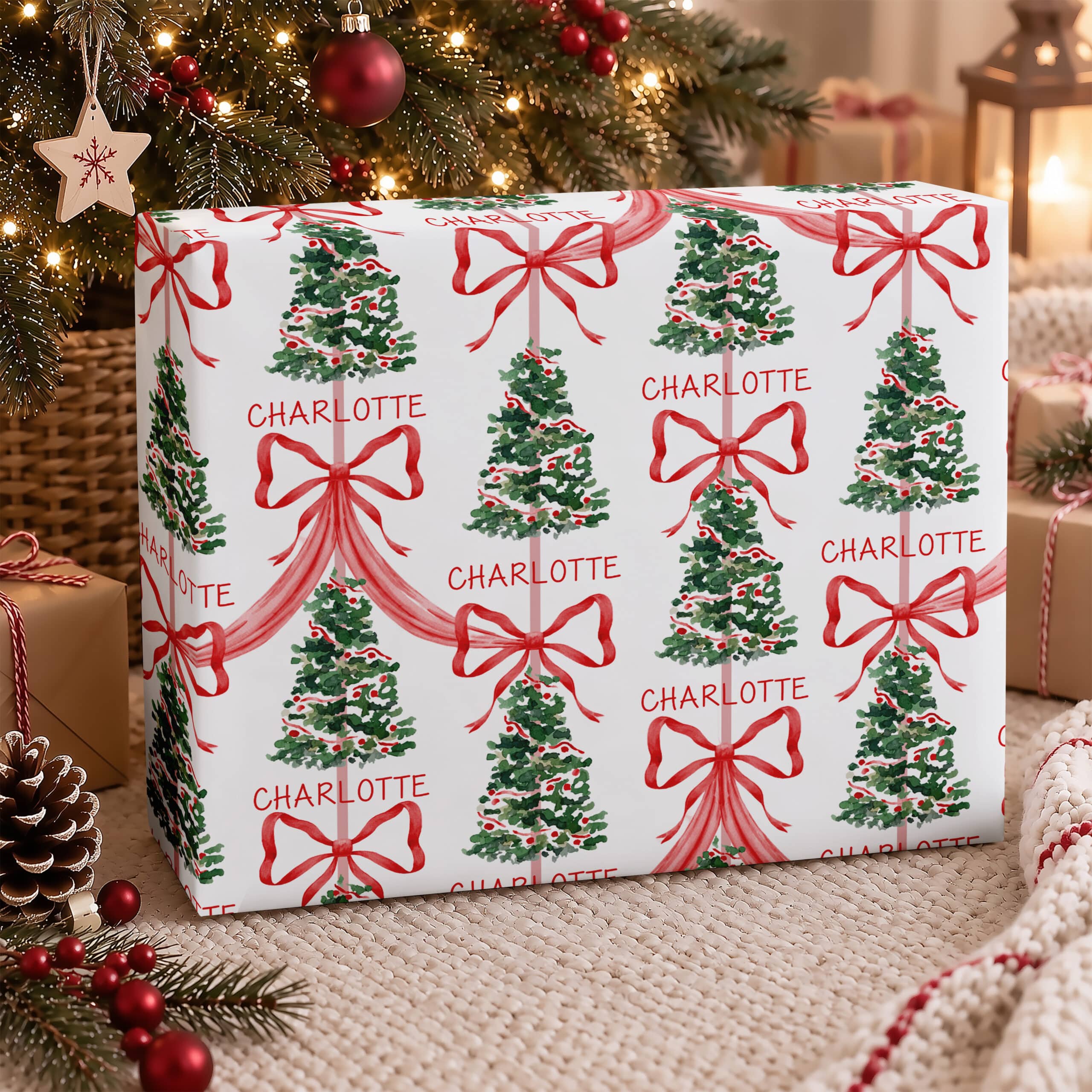 Personalised name Christmas gift wrap with traditional red bows and green Christmas trees