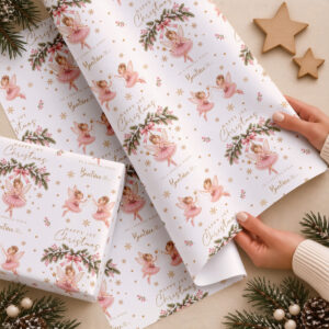 Pink fairy personalised Christmas wrapping paper shown on a wrapped present with matching fairy pattern