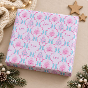 Pink Christmas wrapping paper personalised with a child’s name