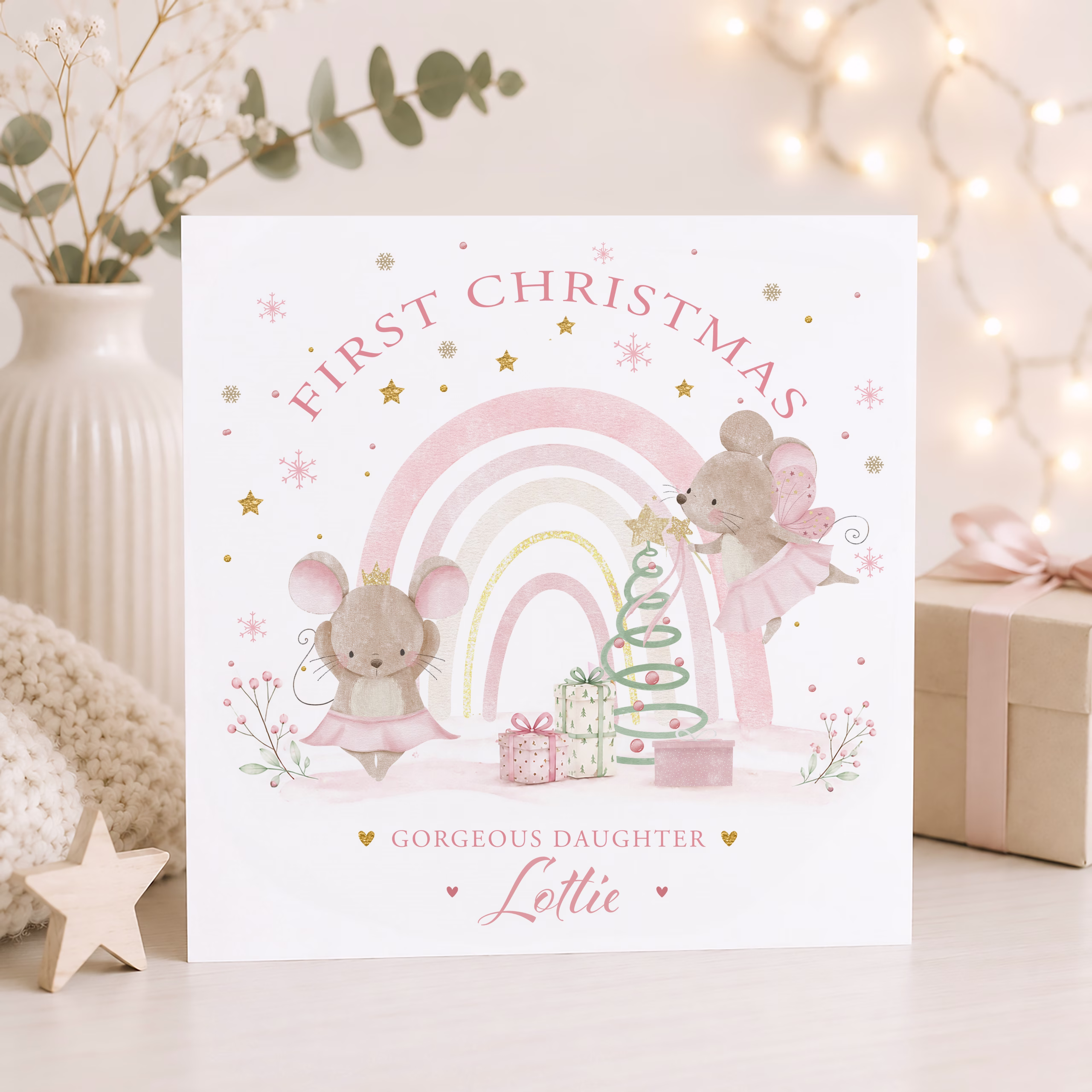 Personalised Baby's First Christmas card with fairy mice and pastel rainbow, suitable for daughter, granddaughter, niece, goddaughter and any relation, with matching gift wrapping paper.