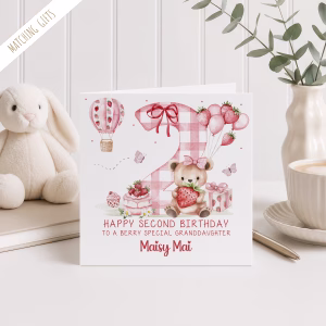 Girls Second Birthday Card in a square design, with a strawberry design, with a giant pink gingham number two in the backround and a strawberry hot air balloon