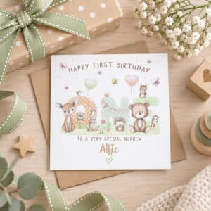 Personalised woodland first birthday card for a boy displayed on a natural nursery style background