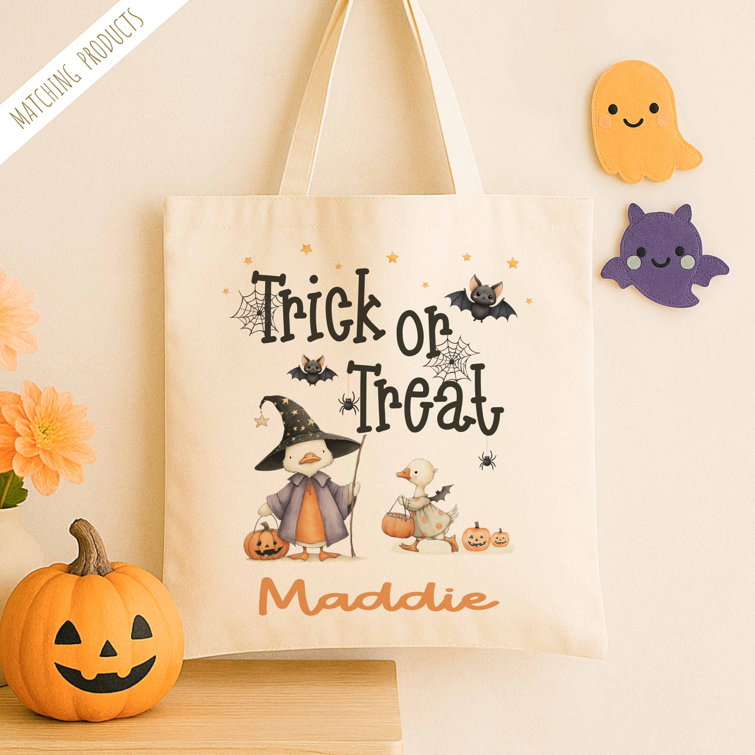 Personalised trick or treat tote bag, with a cute duck design with the childs name added to the bottom in orange print