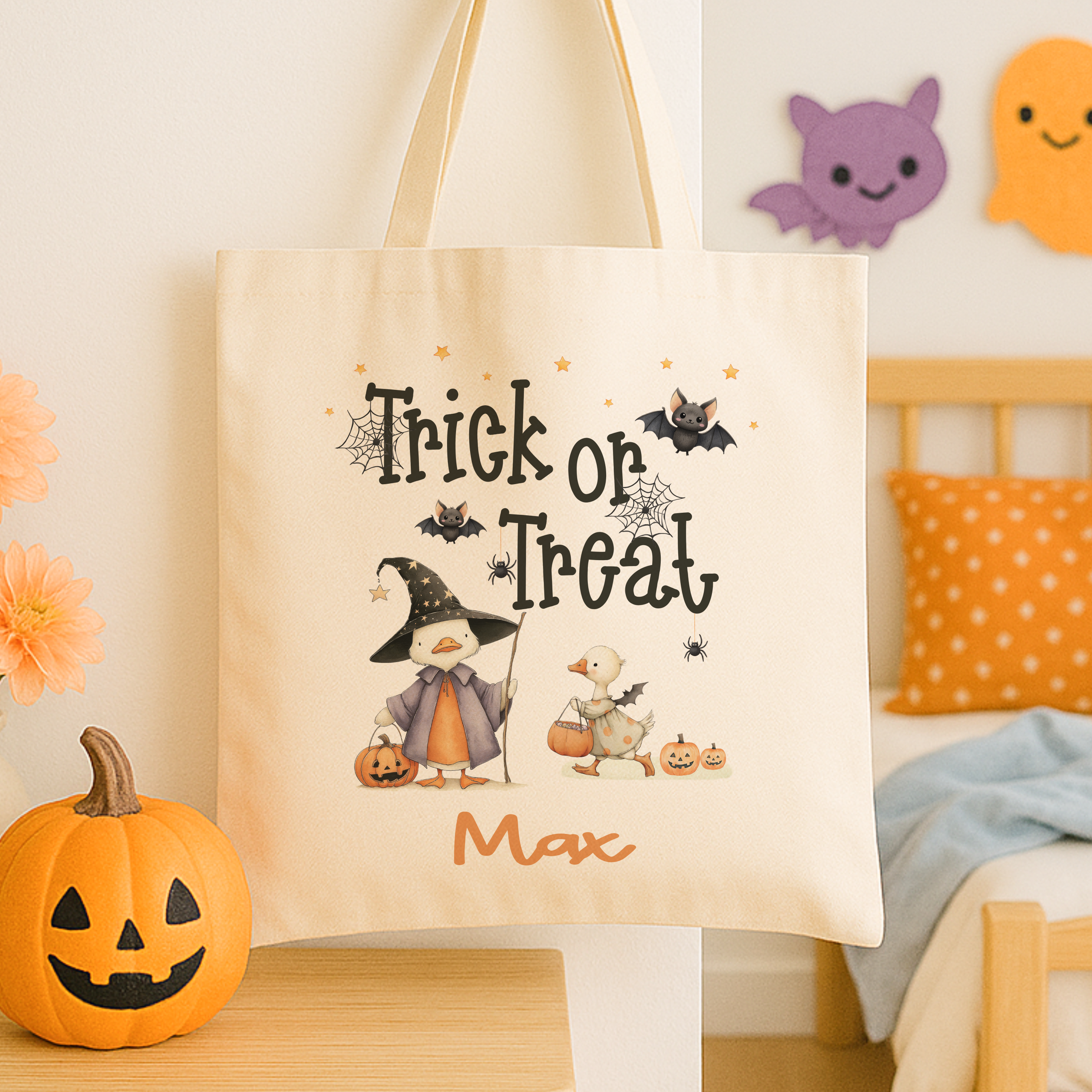 Personalised trick or treat tote bag, with a cute duck design with the childs name added to the bottom in orange print