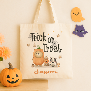 Personalised trick or treat tote bag, with a cute bear design with the childs name added to the bottom in orange print
