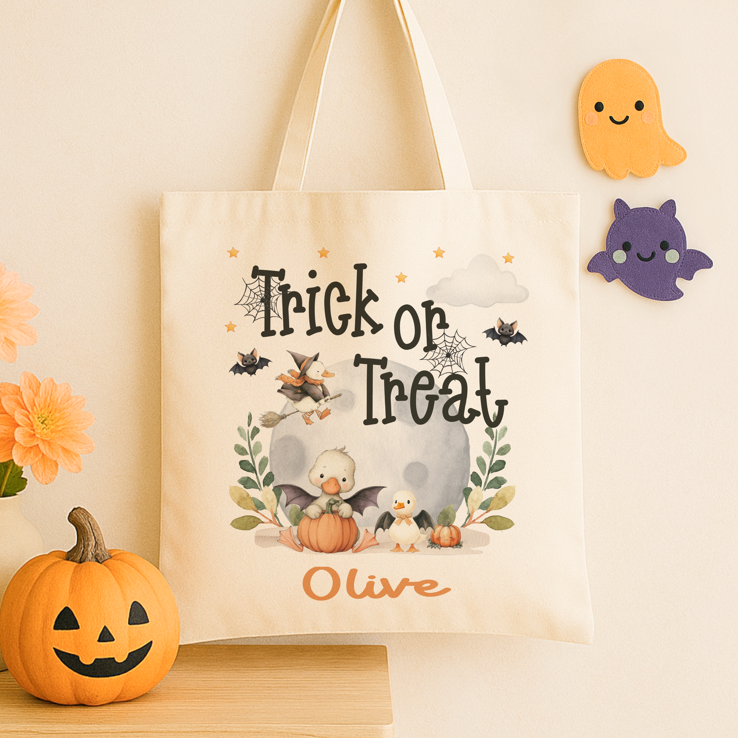 Personalised trick or treat tote bag, with a cute duck design with the childs name added to the bottom in orange print
