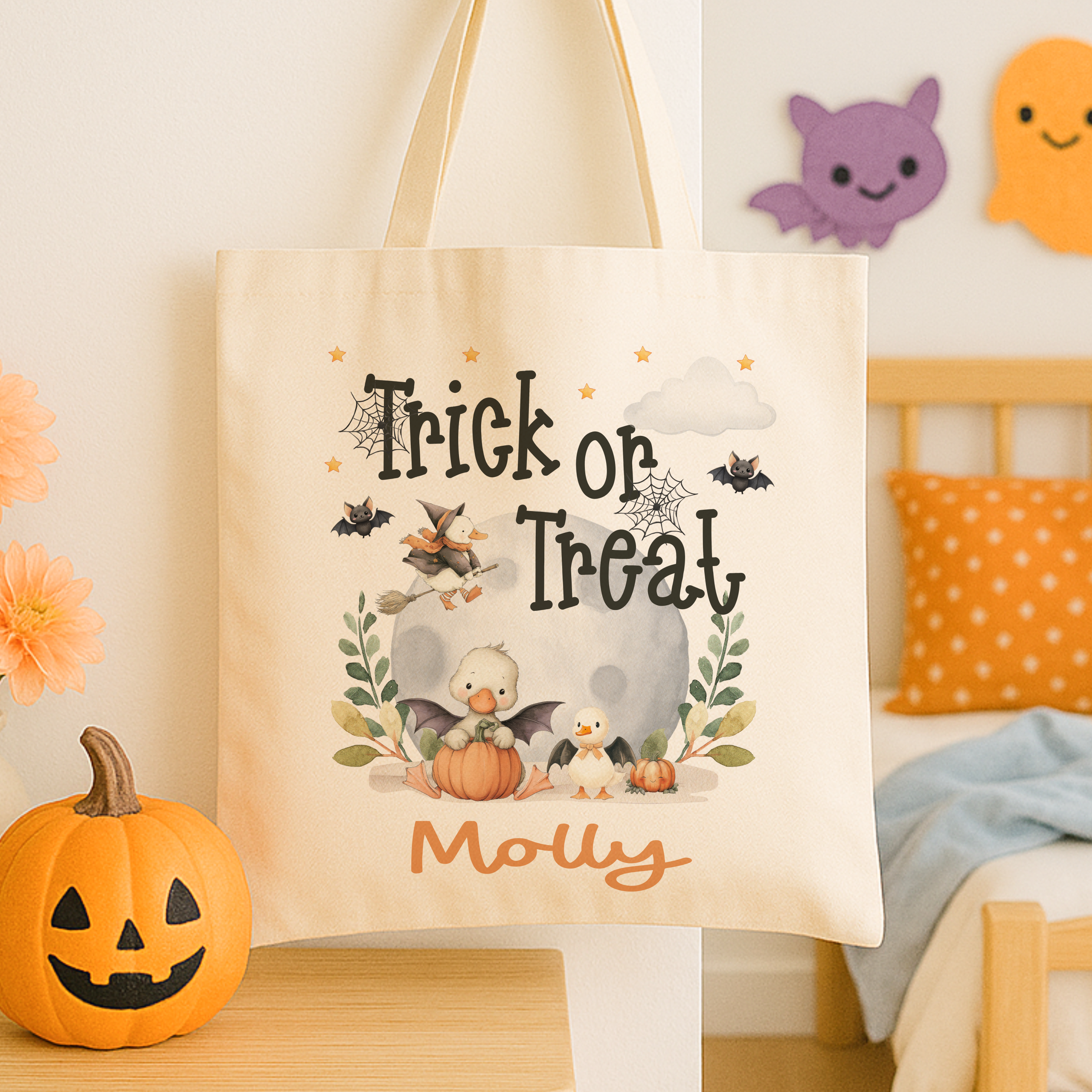 Personalised trick or treat tote bag, with a cute duck design with the childs name added to the bottom in orange print