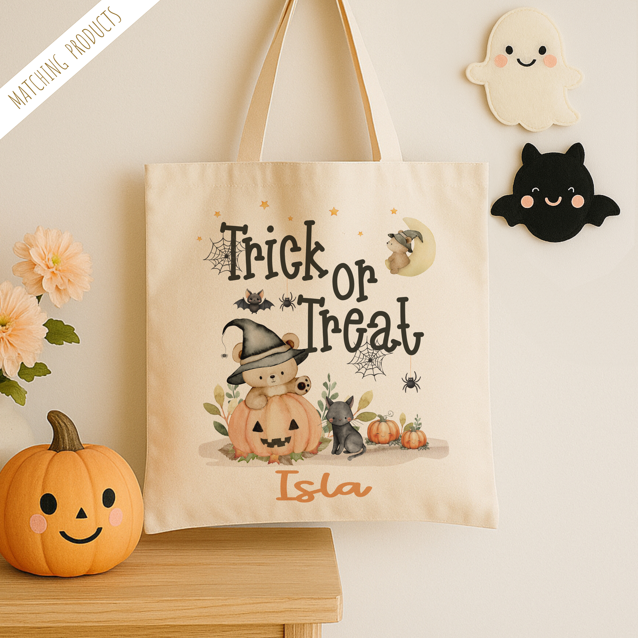 Personalised trick or treat tote bag, with a cute teddy bear design with the childs name added to the bottom in orange print