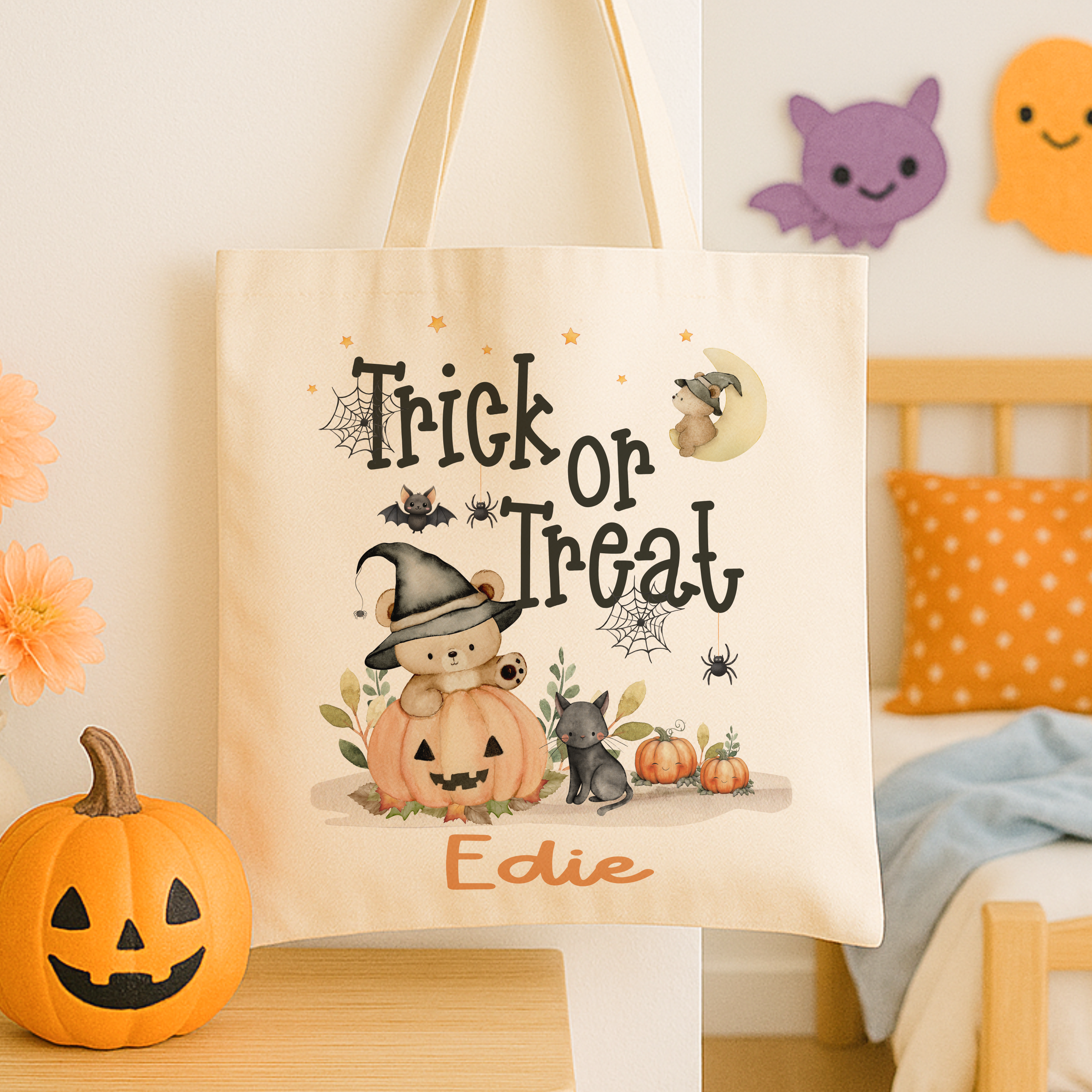 Personalised trick or treat tote bag, with a cute teddy bear design with the childs name added to the bottom in orange print