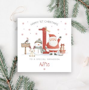 Personalised Baby's 1st Christmas Card, with santa and a snow man in front of a large red number one.