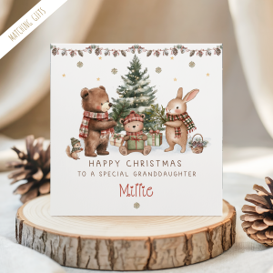 Personalised Teddy Bear Christmas card for children. Featuring a christmas tree with a skating bear with a pile of gifts and a seated bear making a snowman. Personalised at the bottom with the childs name in an ornate brown christmassy font.