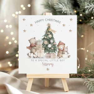 Personalised Teddy Bear Christmas card for children. Featuring a christmas tree with a skating bear with a pile of gifts and a seated bear making a snowman. Personalised at the bottom with the childs name in an ornate brown christmassy font.