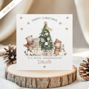 Personalised Teddy Bear Christmas card for children. Featuring a christmas tree with a skating bear with a pile of gifts and a seated bear making a snowman. Personalised at the bottom with the childs name in an ornate brown christmassy font.