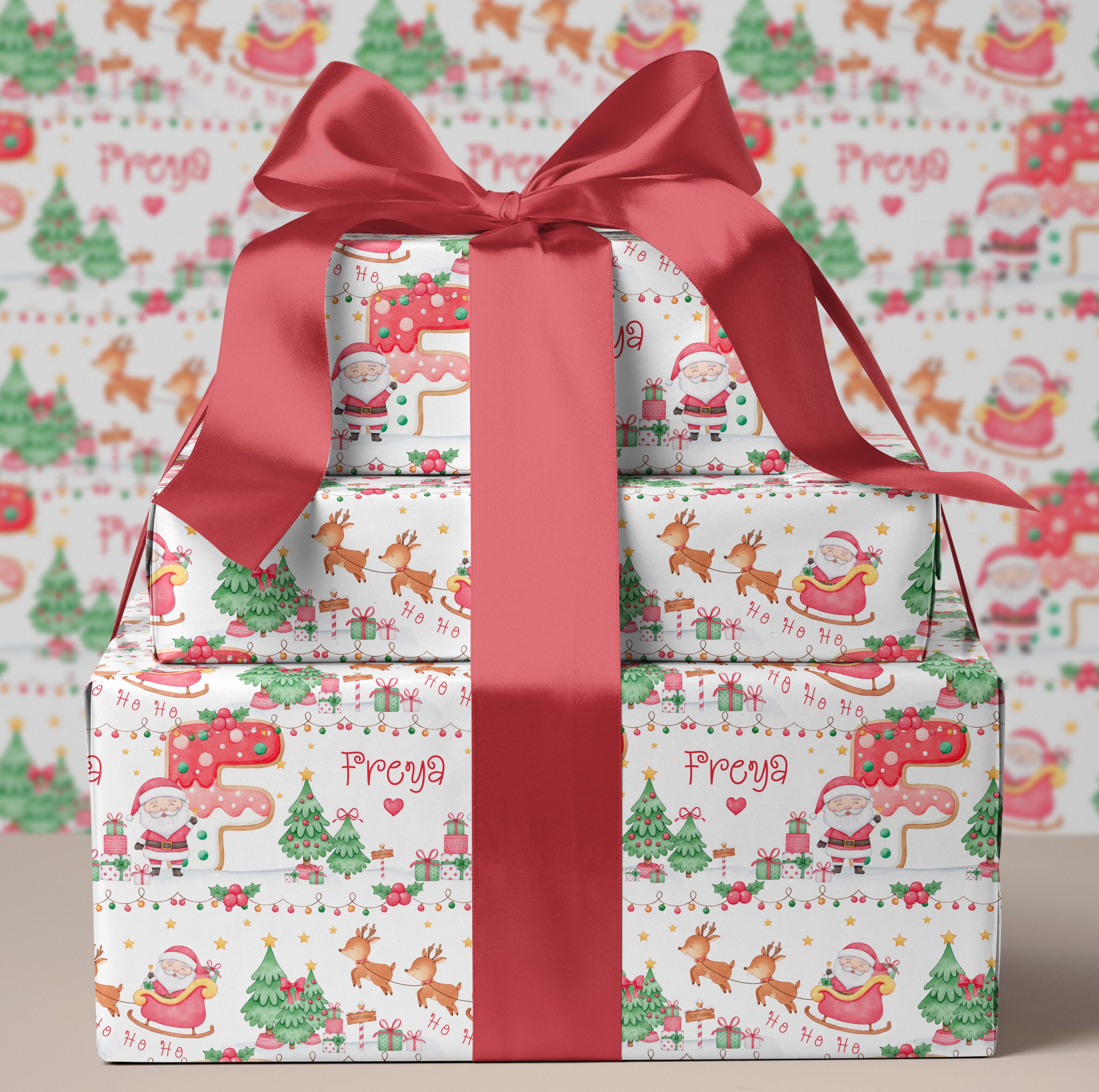 Personalised Christmas Cookie Initial Gift Wrapping Paper. The design shows the name initial in a brightly coloured cookie letter. Surrounded by santa claus in his sleigh with reindeers.