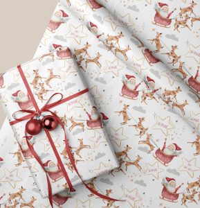This delightful Personalised Santa Christmas Gift Wrapping Paper adds a festive and unique touch to your holiday gift-giving, featuring charming reindeers soaring through the sky with Santa's sleigh filled with presents, making your gifts even more special and memorable