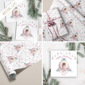 This delightful Personalised Pink Christmas Gift Wrapping Paper adds a festive and unique touch to your holiday gift-giving, featuring a little girl sitting infront of a giant pink bauble with a pile of presents, making your gifts even more special and memorable for friends and family, ensuring your presents stand out with a whimsical and festive touch. Customizable with a name, it adds a personal touch that makes gift-giving extra special and ensures your presents stand out under the tree.