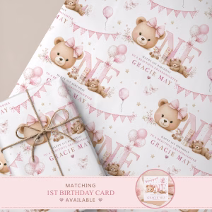 Personalised first birthday wrapping paper with a pink teddy bear, balloons, bunting and the name Gracie May.