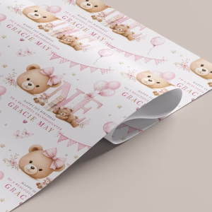 Personalised girls first birthday gift wrapping paper with a soft pink teddy bear, balloons, bunting and large number one
