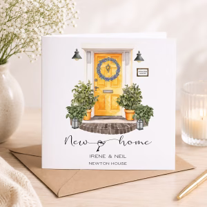 Personalised new home card featuring a yellow front door, plants and the recipients' names and house name.
