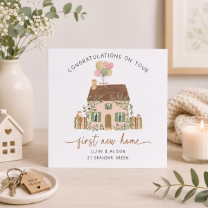 First new home congratulations card with a pretty cottage illustration, flowers, balloons and personalised address.