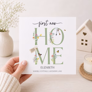 Square new home card featuring floral HOME lettering, butterflies, keys and personalised names and address.