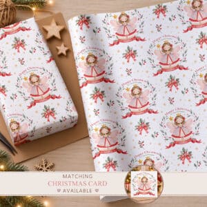 Personalised Christmas fairy wrapping paper featuring a pink and lavender Nutcracker fairy, festive greenery, red ribbons and gold stars.