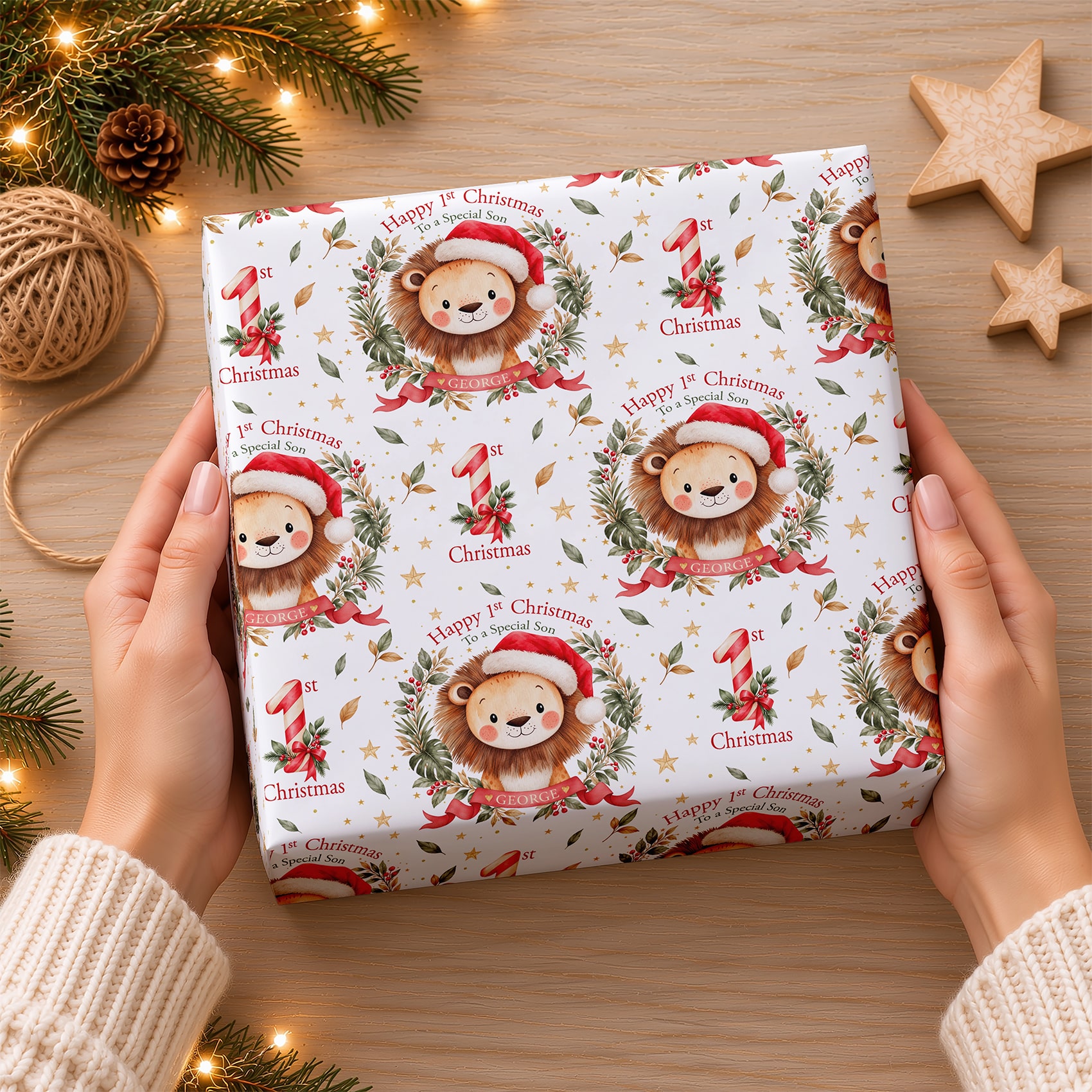 Personalised lion 1st Christmas gift wrap with cute watercolour animal artwork, festive number one decorations and coordinating Christmas card design.