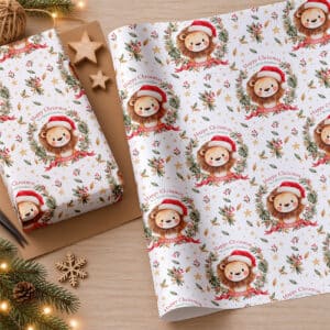 Personalised Christmas gift wrapping paper with a repeating watercolour lion design, festive foliage, red ribbons and gold stars.